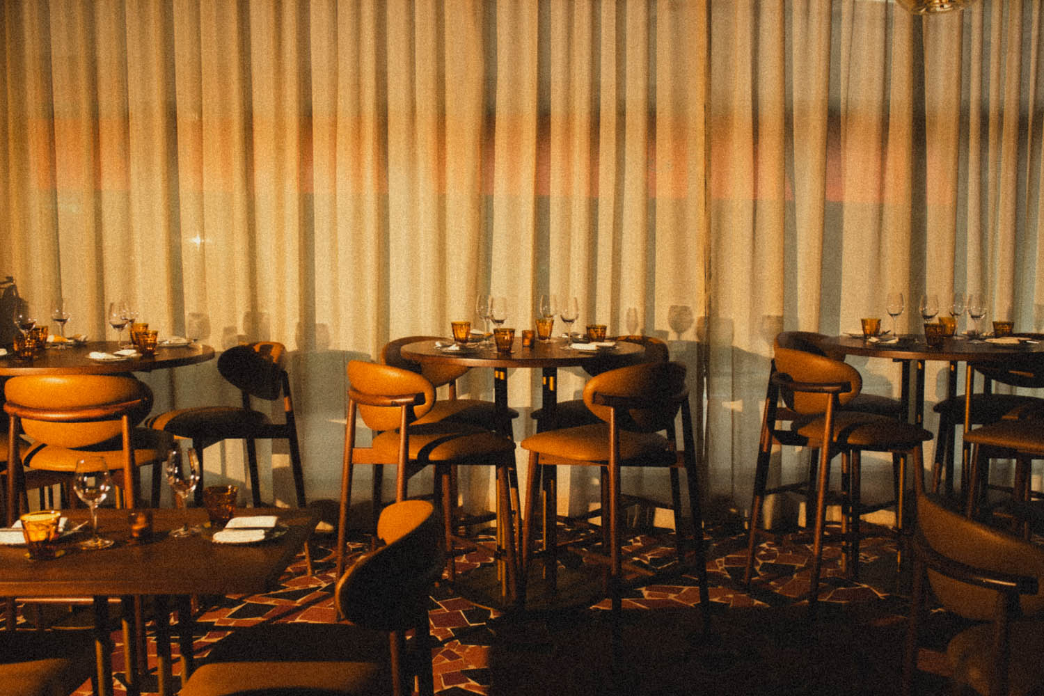 The dining room at golden hour, curtains aglow